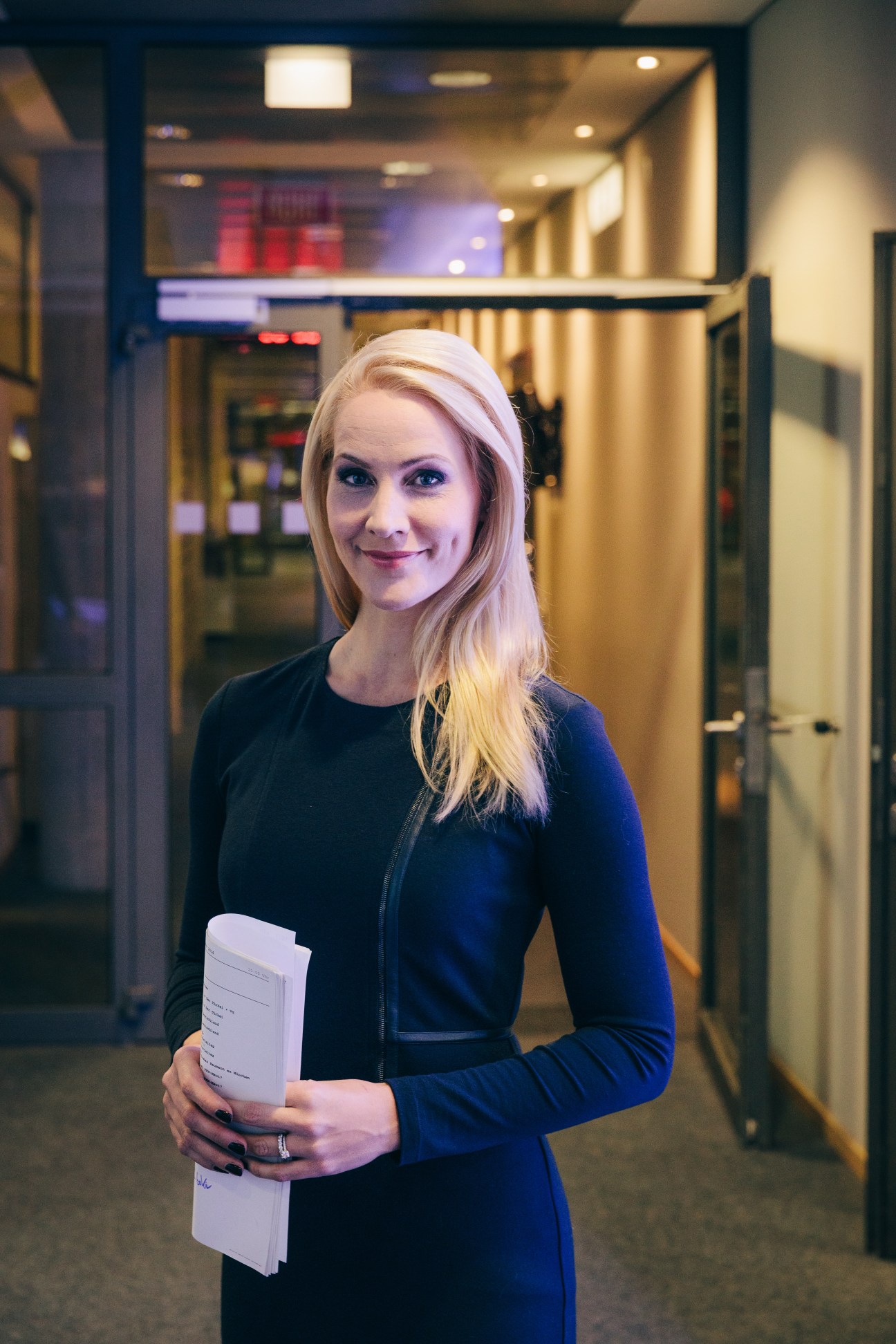 Judith Rakers holds her script in the Tagesschau studio hallway.