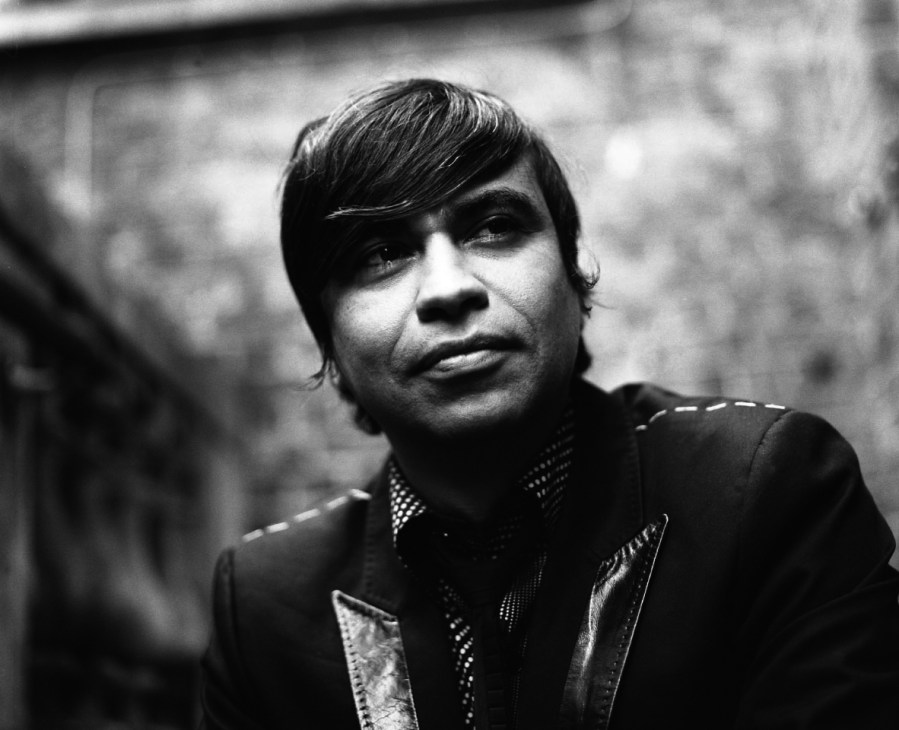 Black and white portrait photograph of Dr Oscar Guardiola-Rivera