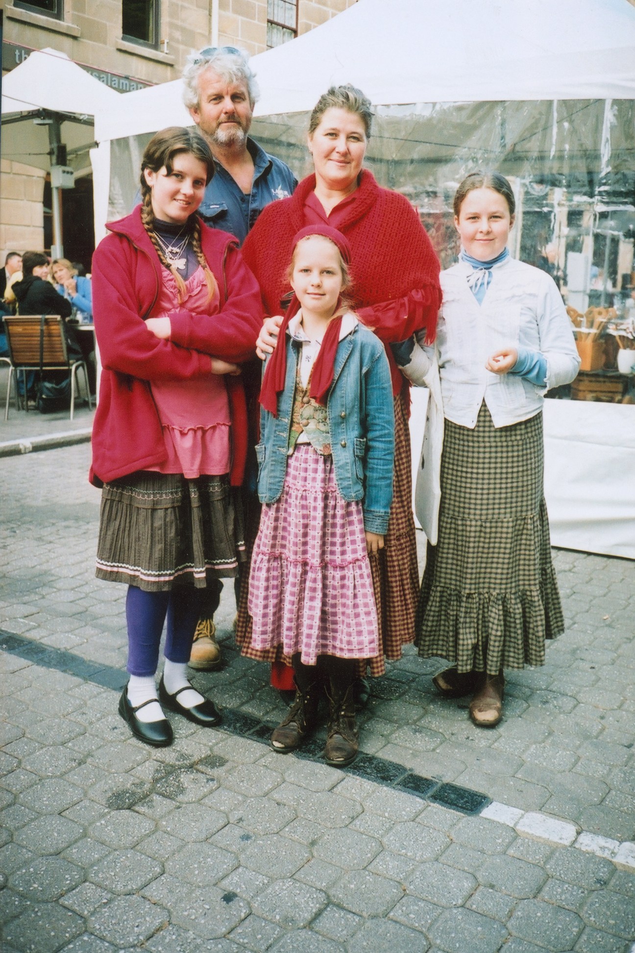 Family of five posing at Salamanca market in Hobart, Tasmania.