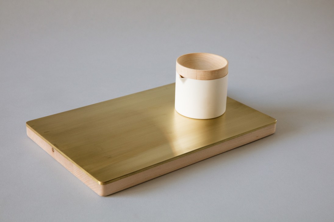 YYY Ceramics pot and cups displayed on a brass tray against a neutral background