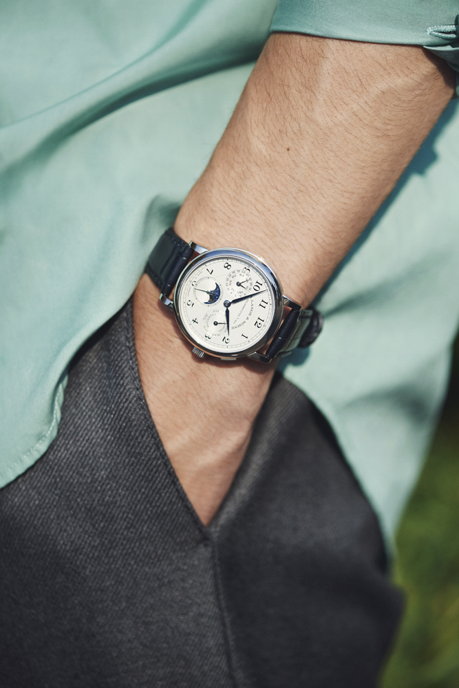 Model in business casual outfit with shirt, trousers and luxury watch
