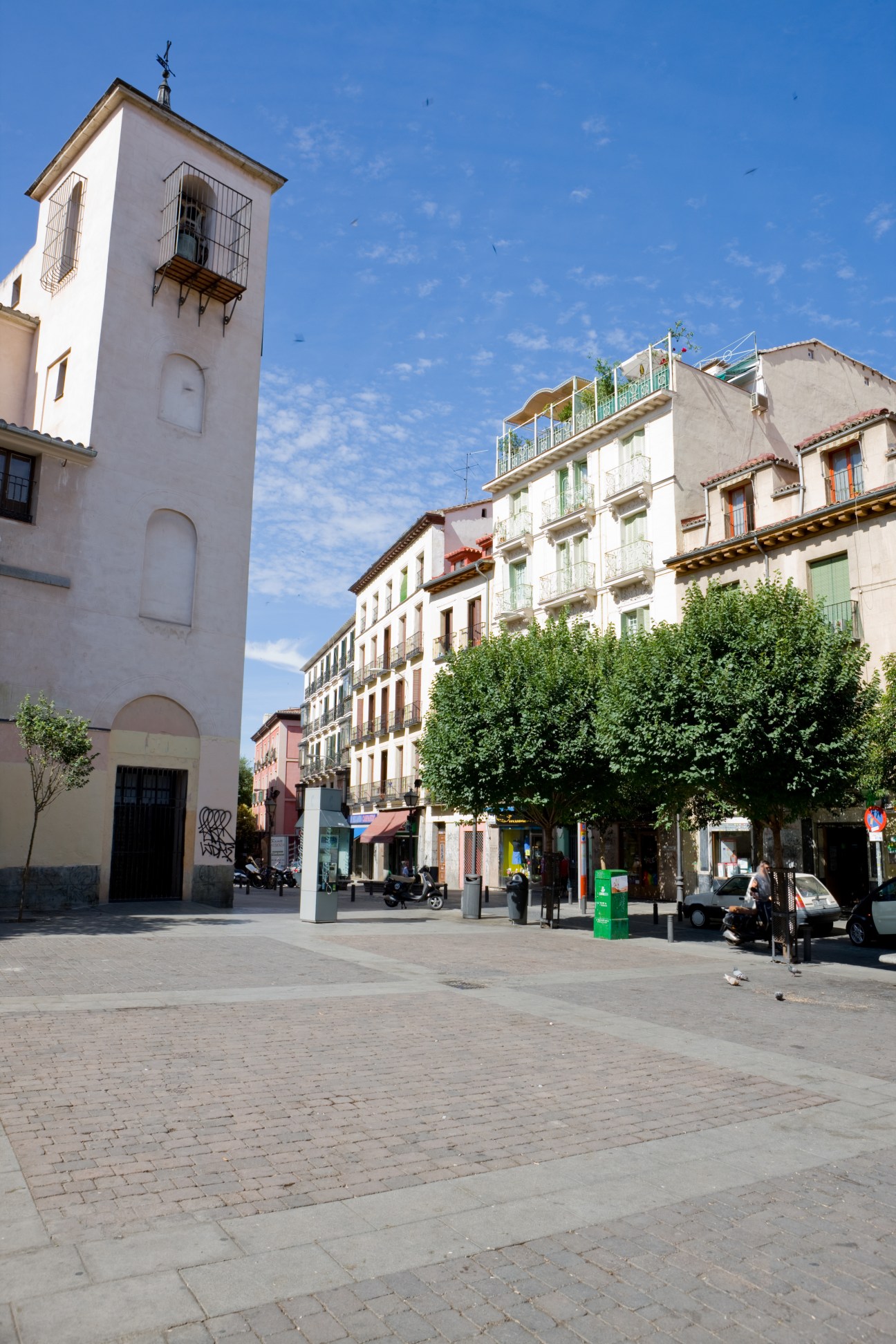 Plaza San Idelfonso in Madrid's Malasaña neighbourhood with Bourbon-era balconied buildings and a church tower.