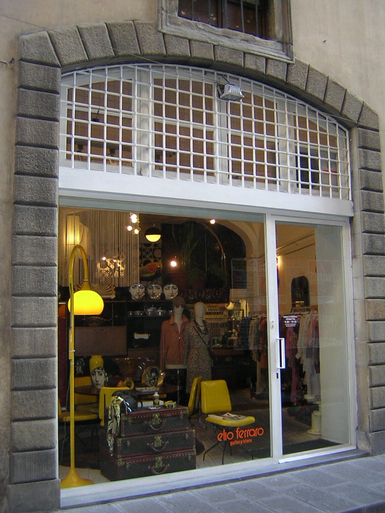 Elio Ferraro's Florence store exterior showcasing vintage couture and tailoring services on via del Parione.