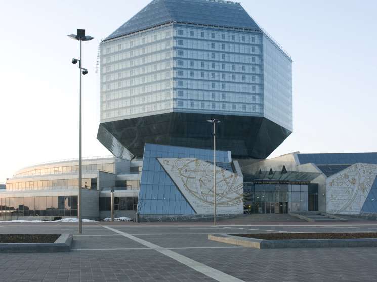 Modern National Library of Belarus building with distinctive inverted pyramid design and geometric relief panels.