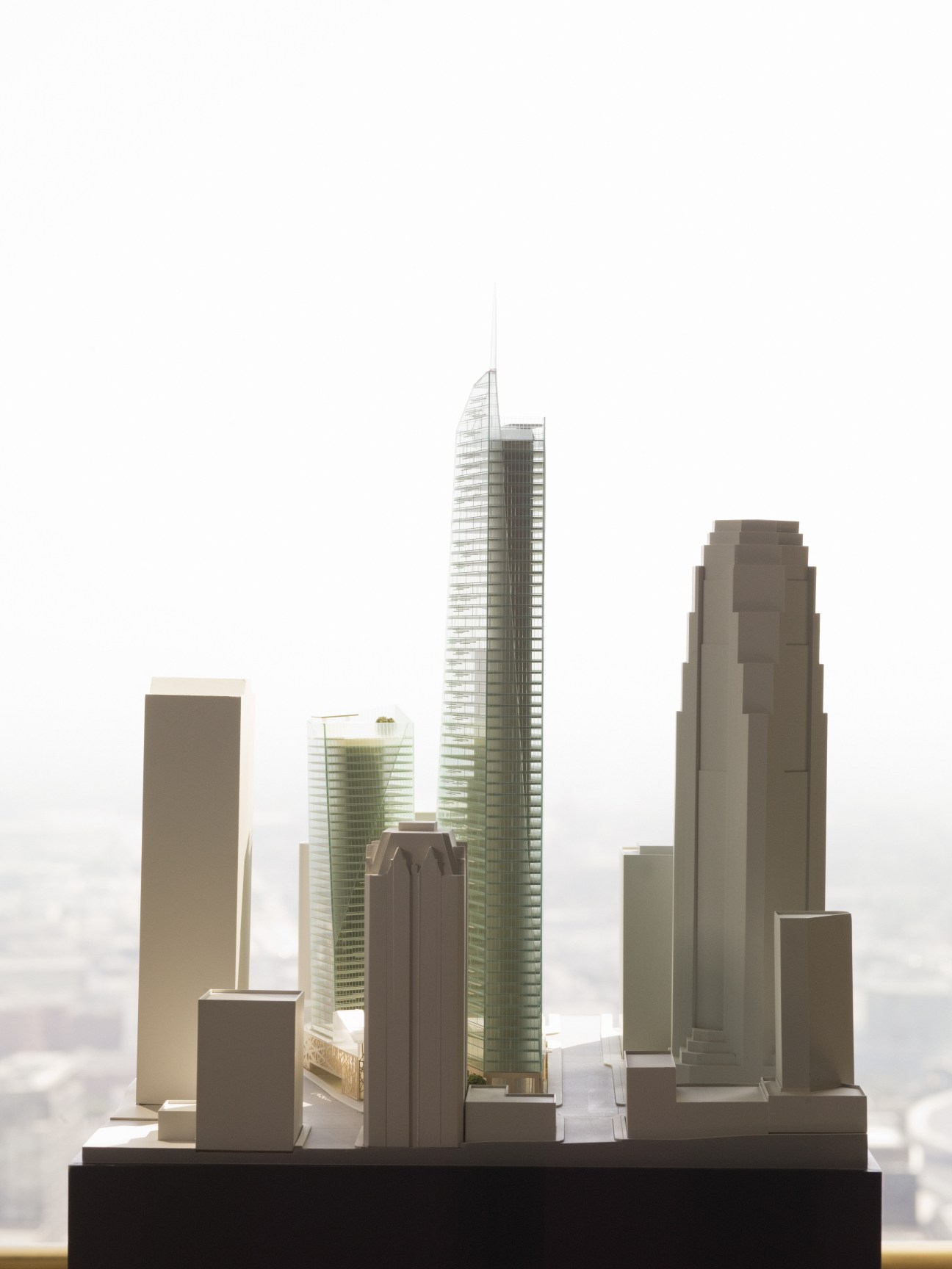 Architectural models of potential Koreatown developments displayed on a black base.