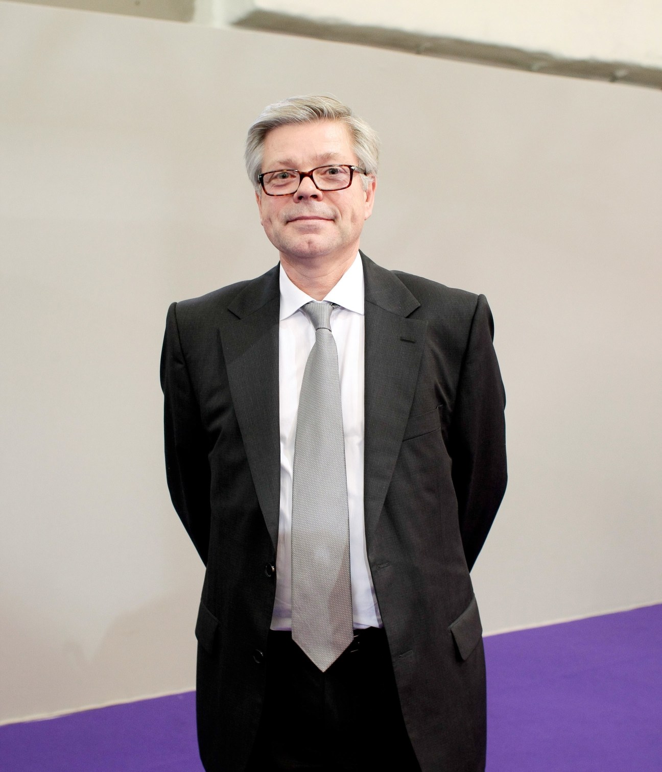 Jean-Christophe Goulemot, Pharmagora exhibition director, wearing glasses and business attire.