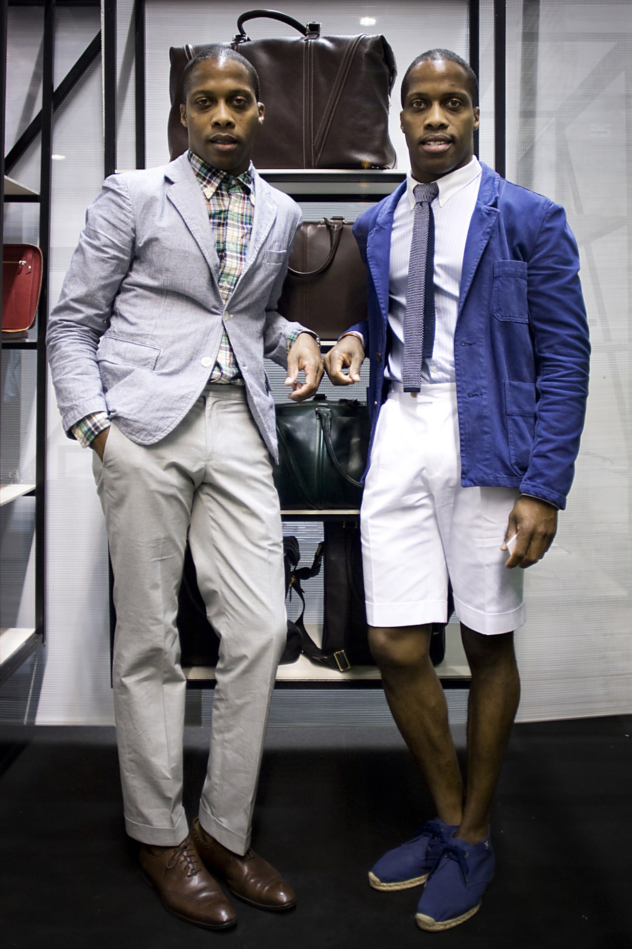 Twin brothers Dexter and Byron Peart of Want Les Essentiels de la Vie pose with travel bags and luggage.