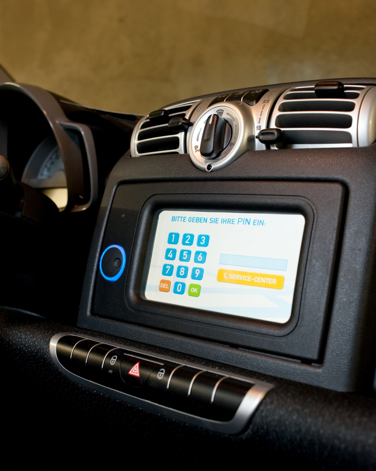 Car2go Smart car dashboard display showing PIN entry screen with German text prompt.