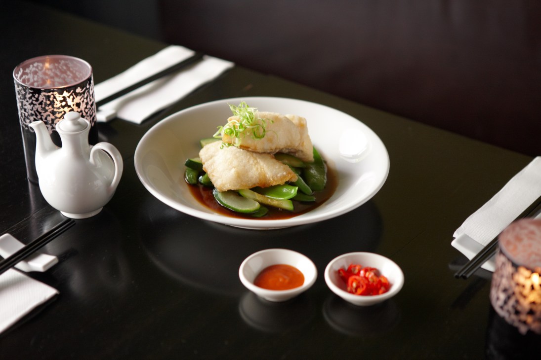 Steamed scallop and prawn dumplings with sugar snap peas served at Fei Jai restaurant.