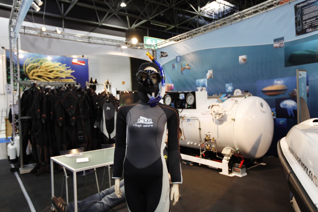 Diving exhibition display with mannequin wearing Rough Waters wetsuit and diving gear at Boot 2011.