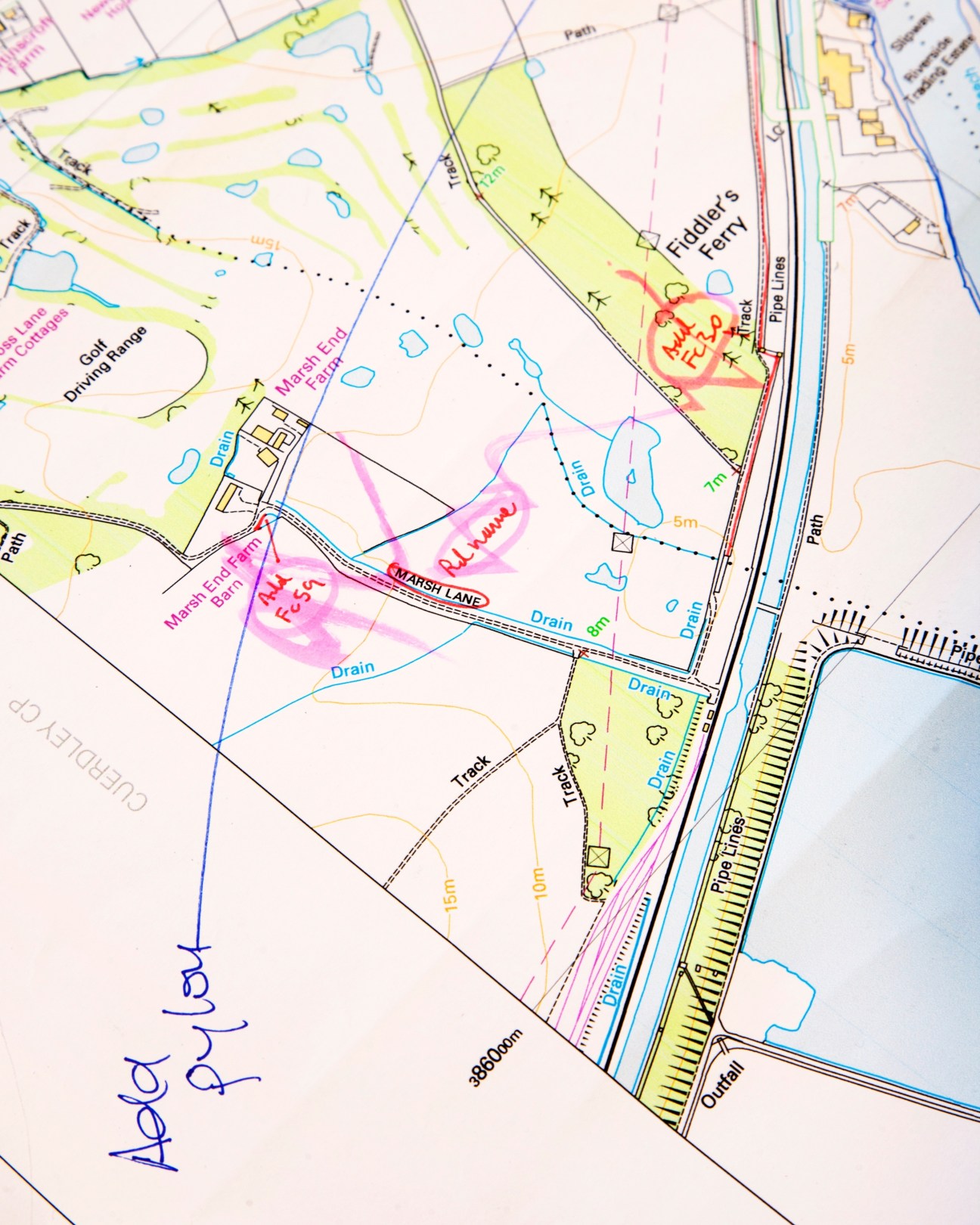 Ordnance Survey map undergoing quality control with colored annotations and markings.