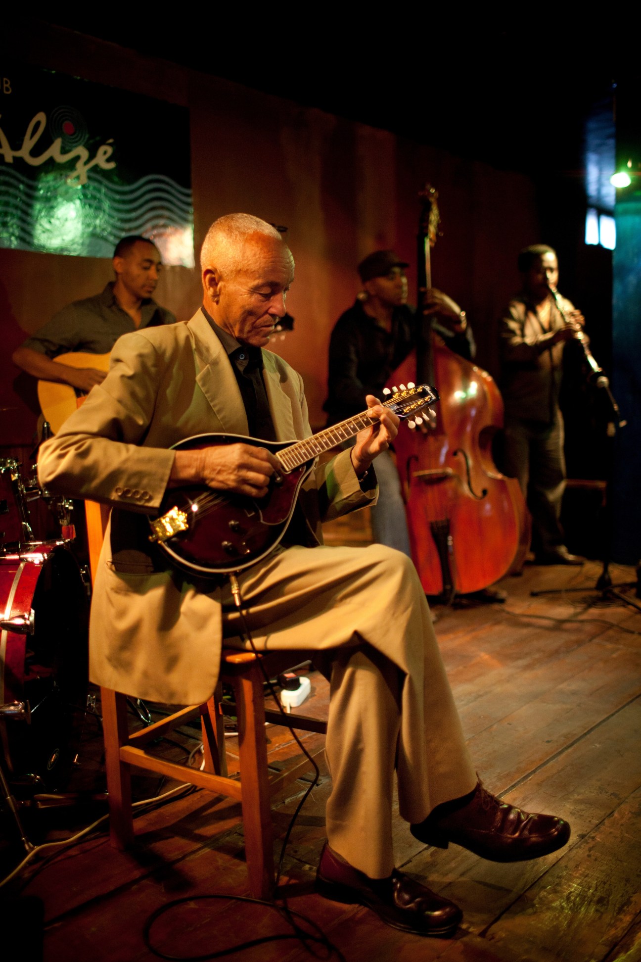Elderly musician Ayele Mamo plays mandolin on stage at Club Alizé in Addis Ababa during an ethio-jazz performance.