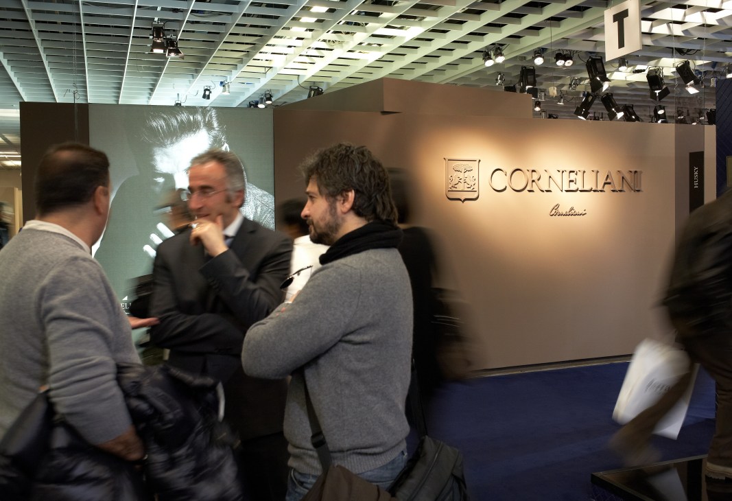 Visitors at the Corneliani stand during Pitti Immagine Uomo menswear trade show in Florence.