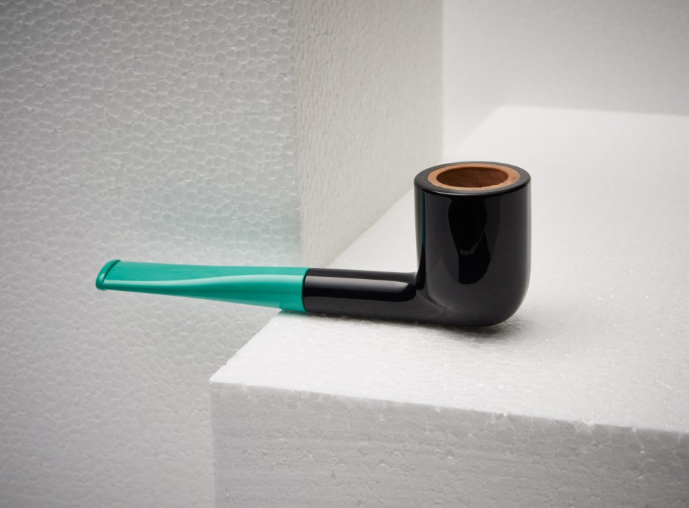 Stiff billiard pipe with turquoise thermoplastic stem and black bowl with briar wood tobacco chamber.
