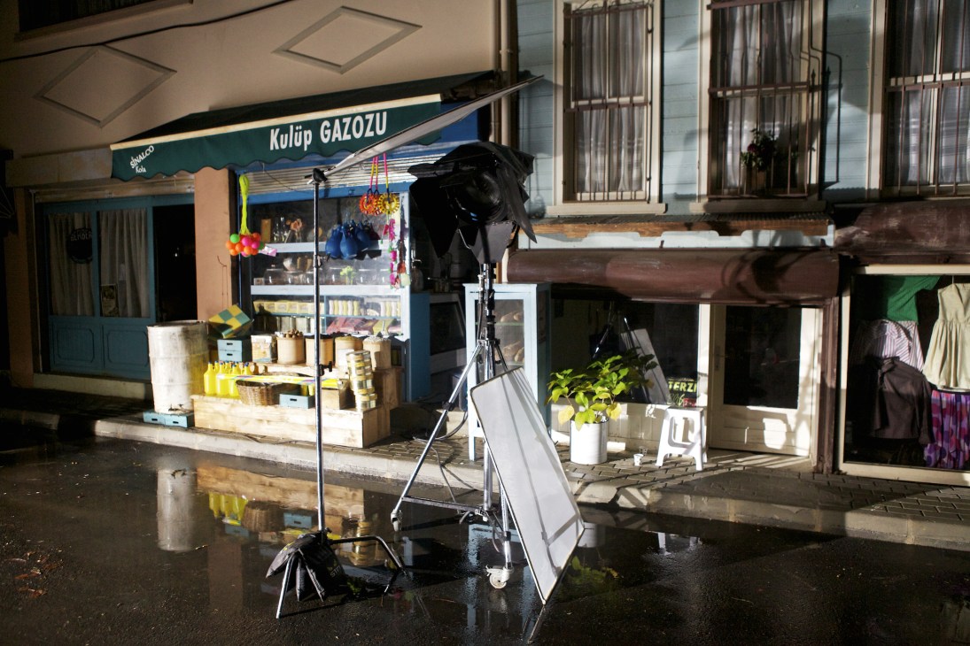 Film crew equipment and lighting setup on an Istanbul street at night during production.