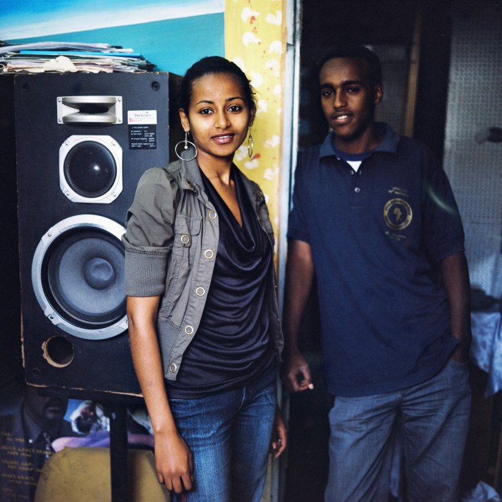 Rita Neglash and Ermias Hiwet pose at Blenda Media Productions in Asmara next to audio equipment.