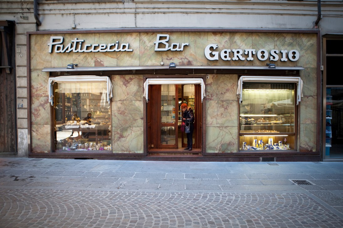 Exterior of Pasticceria Bar Gertosio storefront with marble facade and display windows in Turin