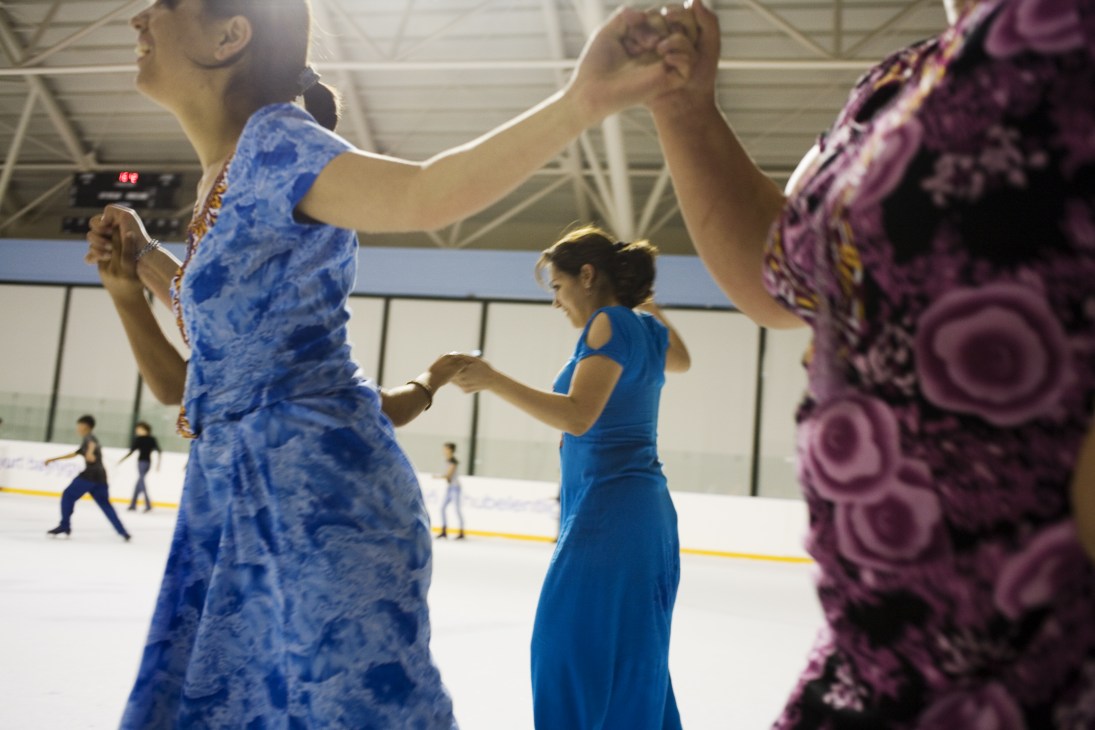 Skaters hold hands at an indoor ice rink in Ashgabat, Turkmenistan.