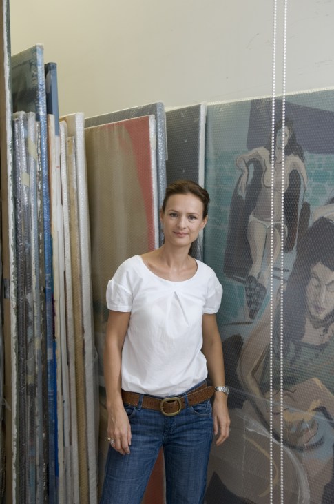 Isabelle van den Eynde stands in front of artwork at B21 gallery in Dubai.