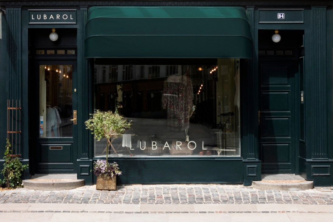 Lubarol boutique storefront in Copenhagen with dark teal facade and large window display.