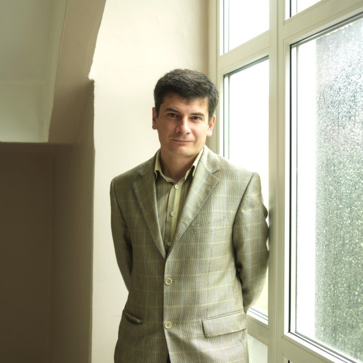 Igor Goldfarb of NGO Pacific Environment standing in a hallway by windows