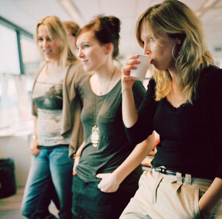 Media workers take a coffee break at a broadcasting facility.