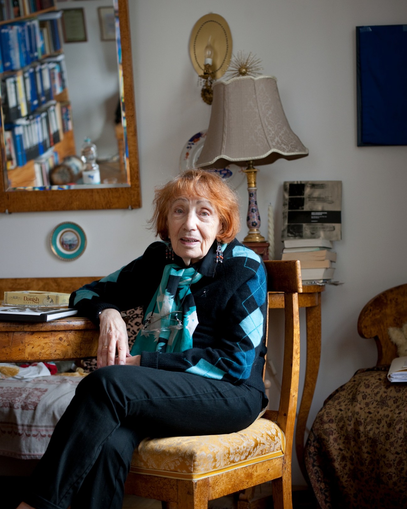Dr Maya Turovskaya, a film and theatre critic, sits in her Munich apartment surrounded by books and personal furnishings.
