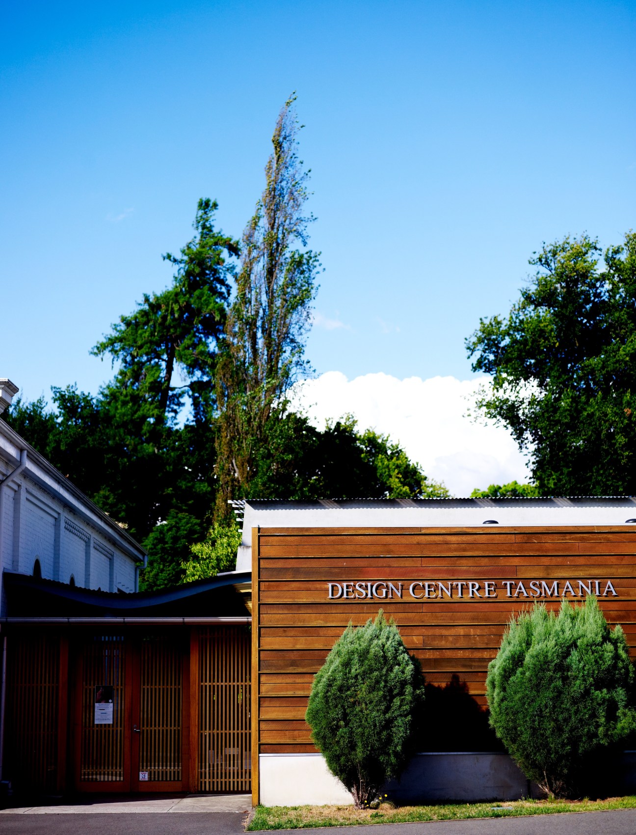 Exterior of Design Centre Tasmania building with wooden facade and signage