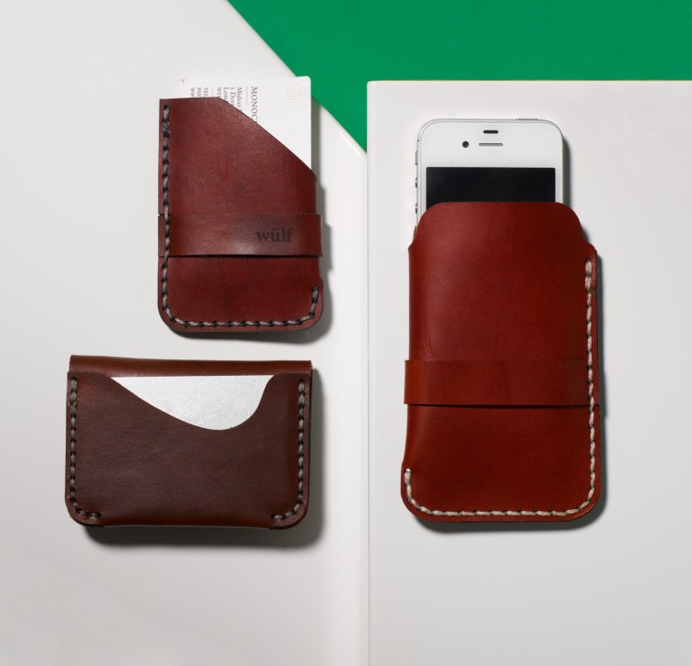 Wülf hand-sewn leather goods including a red leather phone holder, card holder, and wallet with contrasting stitching.