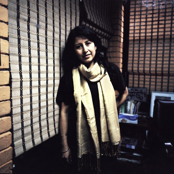 Charu Chadha Rizal, associate editor of 'The Boss' magazine, poses indoors against a brick wall.