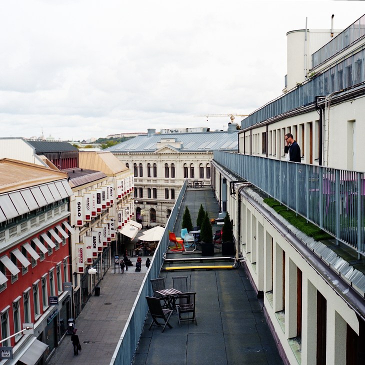 Elevated view of central Gothenburg showing shopping district with red and white striped awnings and historic buildings