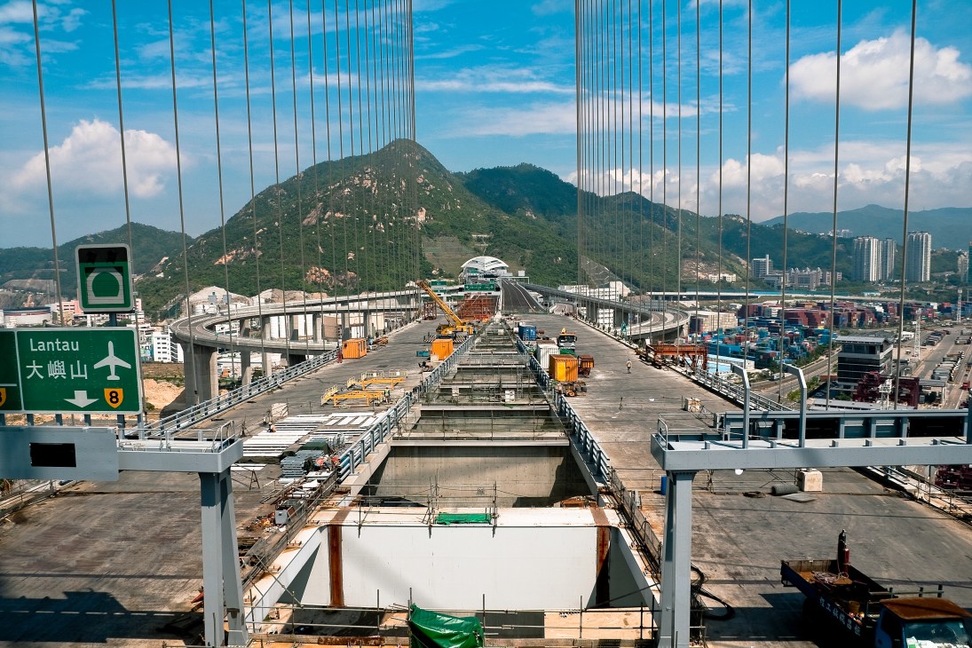 Stonecutters Bridge cable-stayed bridge spanning Hong Kong port with dual vehicle decks and 300m towers under construction.