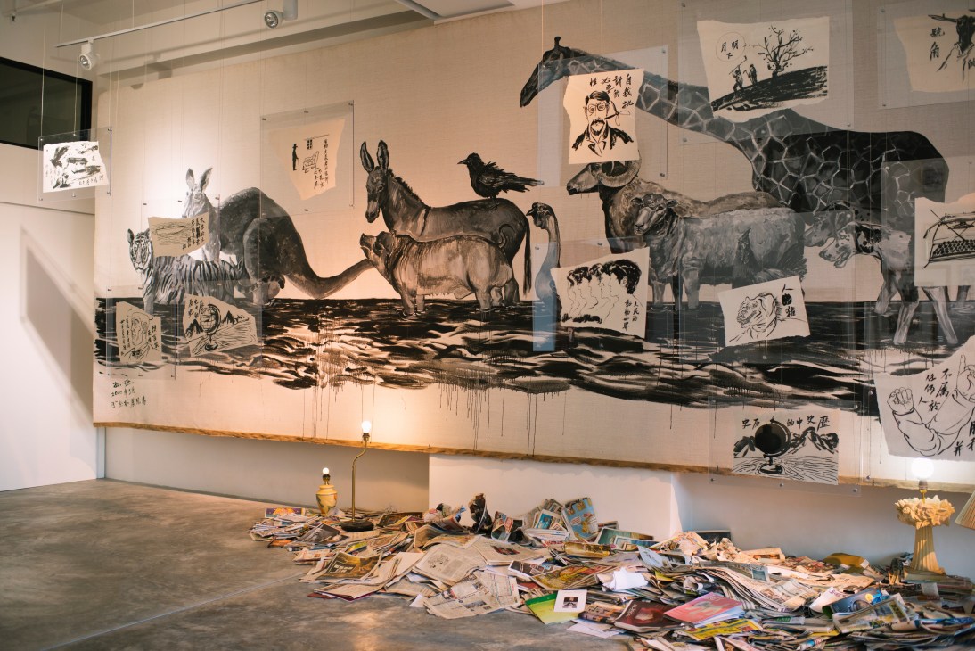 Platform China gallery interior in Hong Kong's Chai Wan with large-scale contemporary art installation featuring ink drawings of animals and figures.