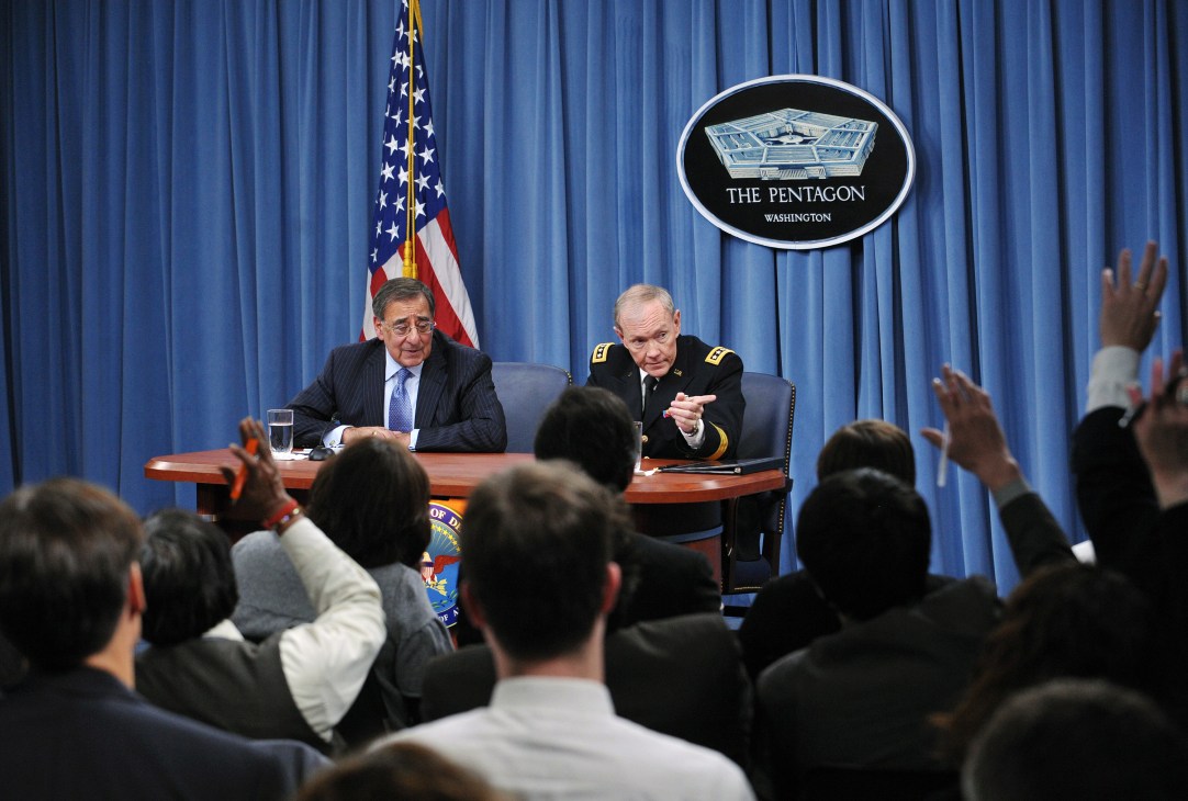 Pentagon officials speak at a press conference at the Pentagon building in Washington.