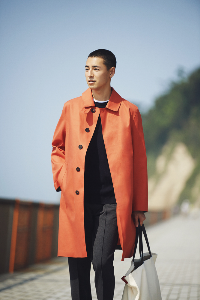 Elegant layered coat look with luxury accessories