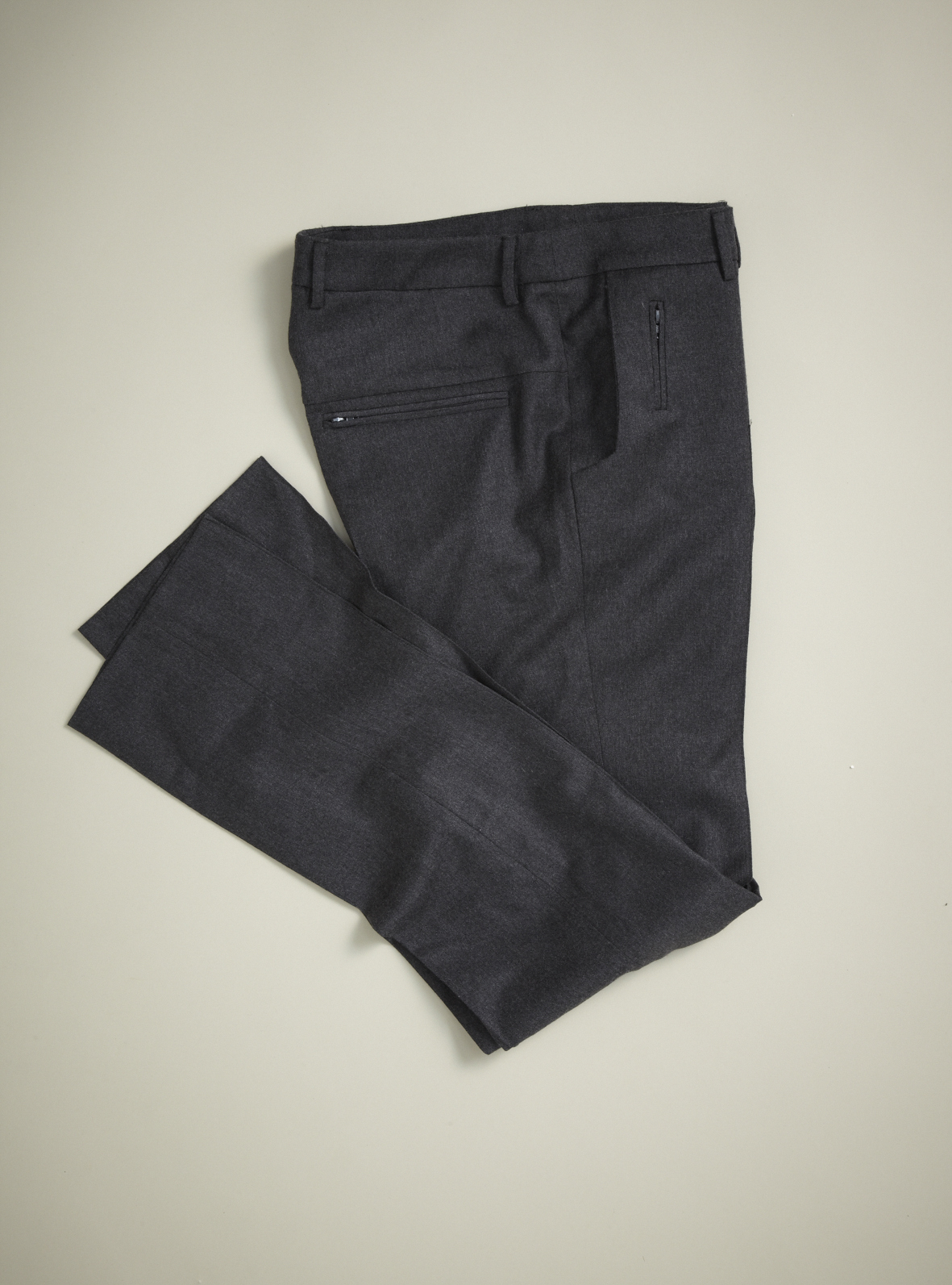 Charcoal wool-cotton blend trousers folded flat against a neutral background.