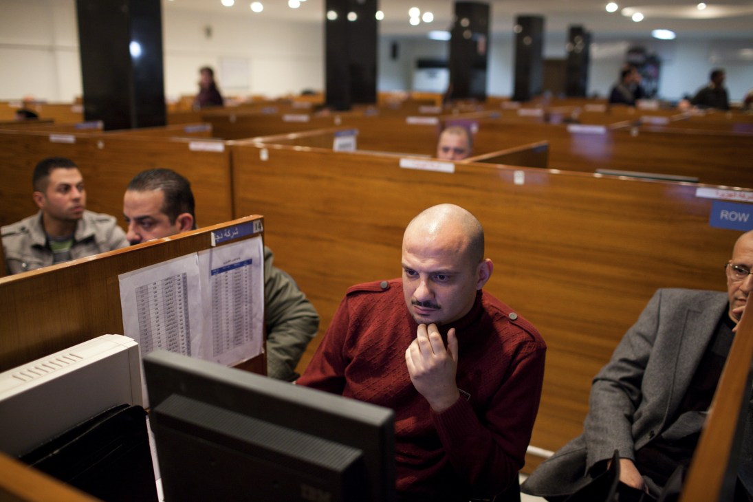 Stockbrokers trading at computer terminals in the Iraq Stock Exchange.
