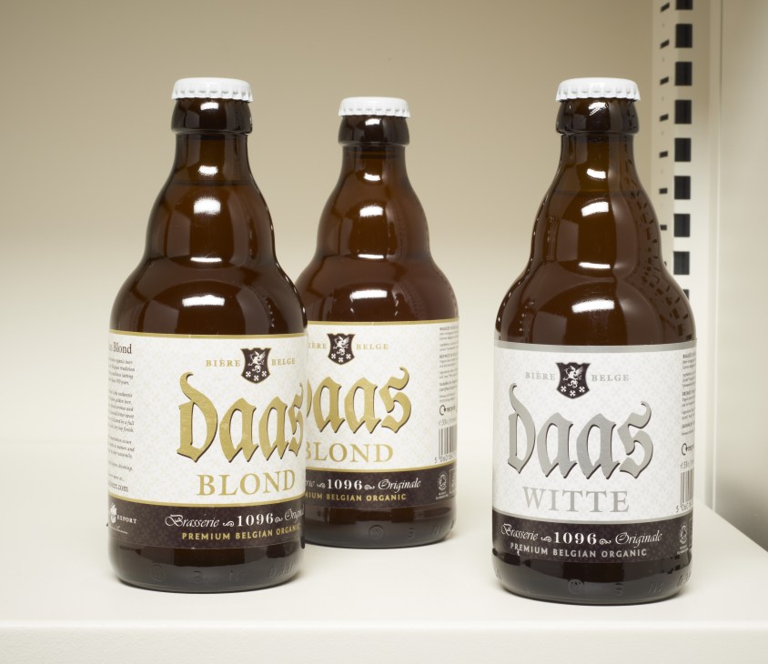Three bottles of Daas Belgian organic craft beer varieties including Blond and Witte.