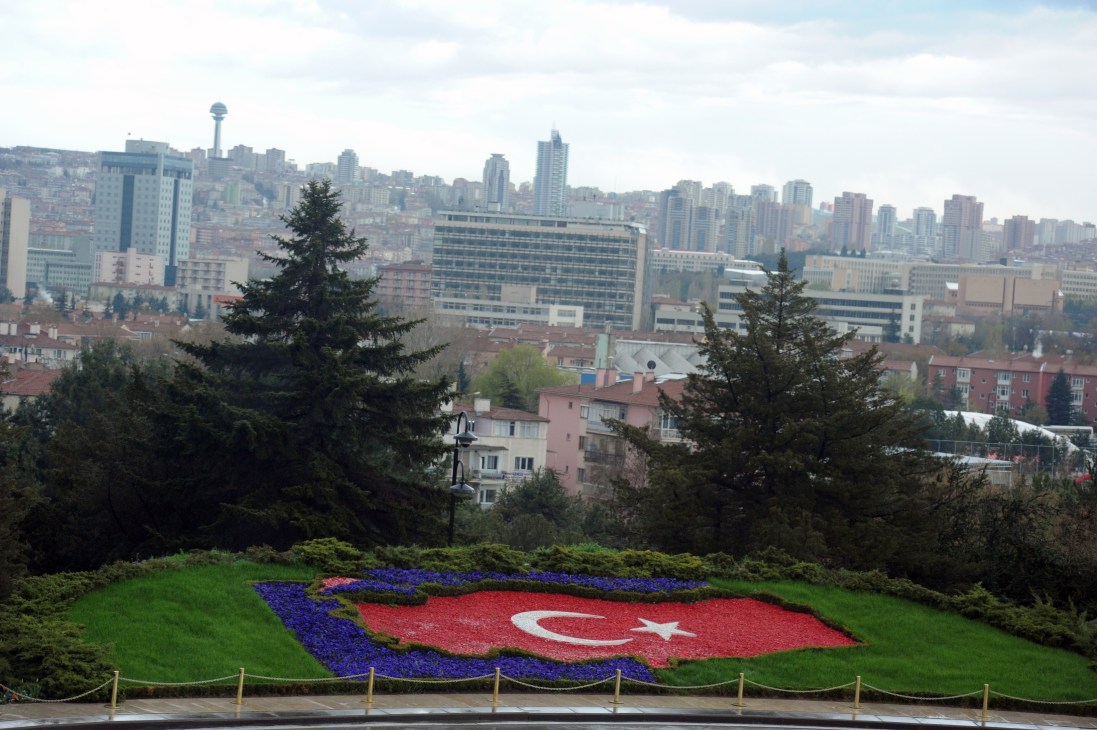 Ankara cityscape with Turkish flag floral display in foreground