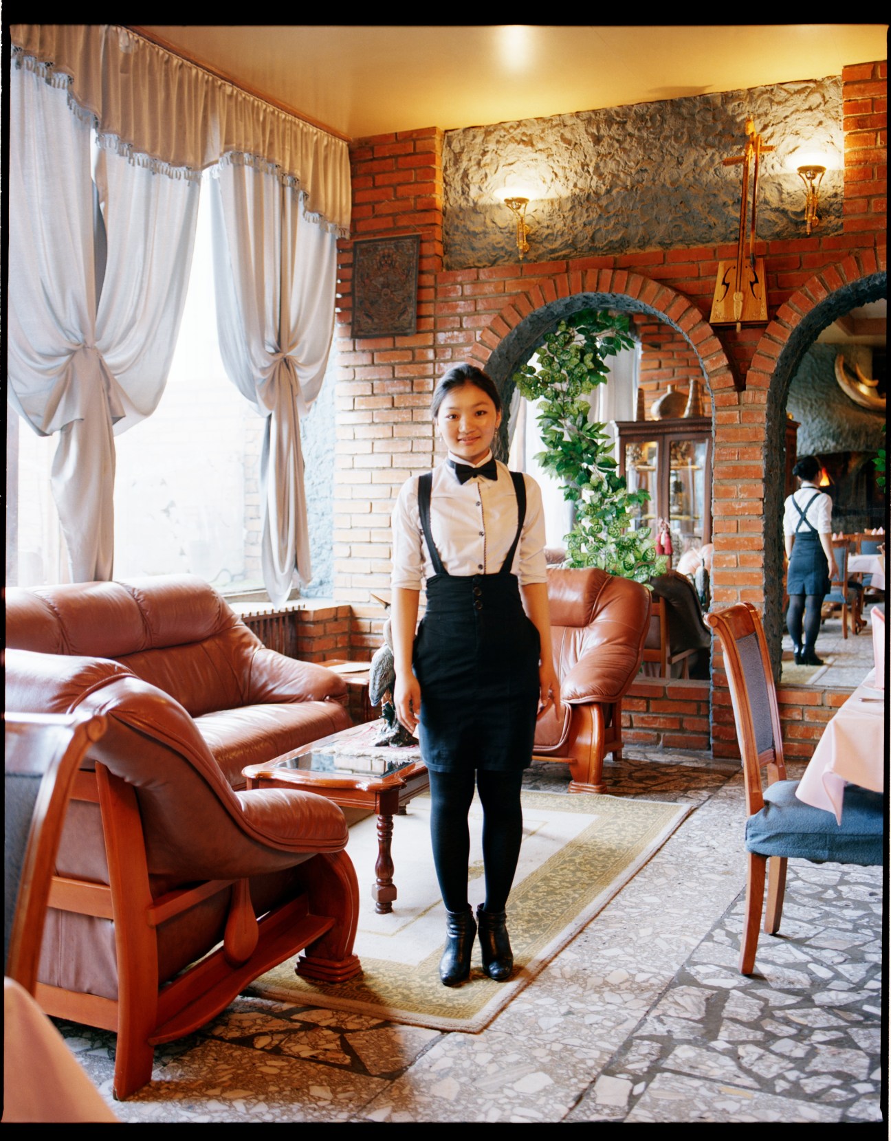 Waitress in formal attire at the Marco Polo restaurant in Ulan Bator