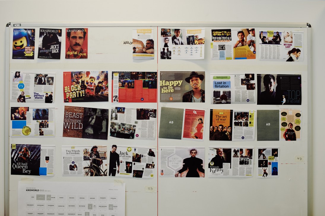 Design wall displaying layout samples and spreads for Singapore Airlines' KrisWorld magazine