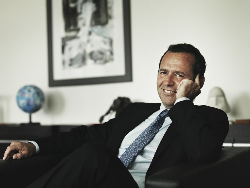 Eric Falt, assistant director-general for external relations and public information, smiles at his desk in a Unesco office.