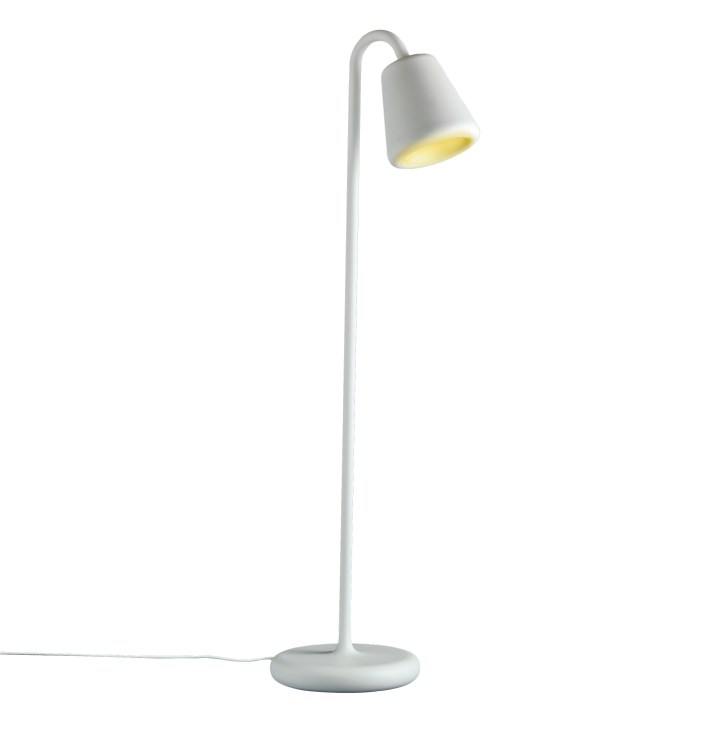 White arched floor lamp with cylindrical shade and warm yellow light glow on white background.