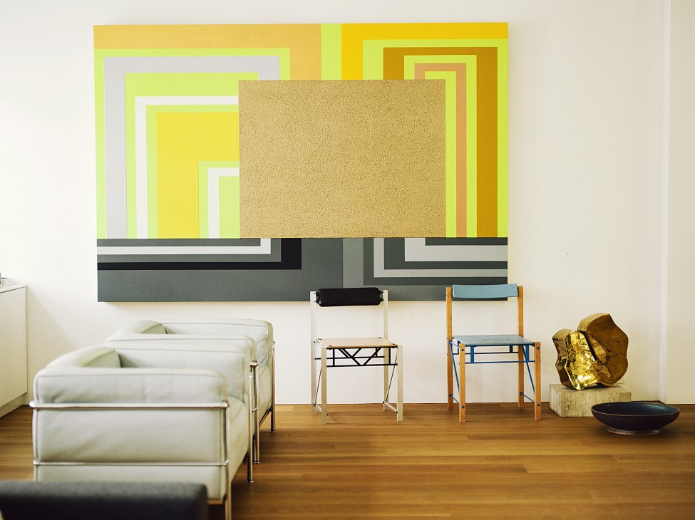 Le Corbusier LC2 chairs and Peter Halley painting in minimalist Helsinki penthouse interior.