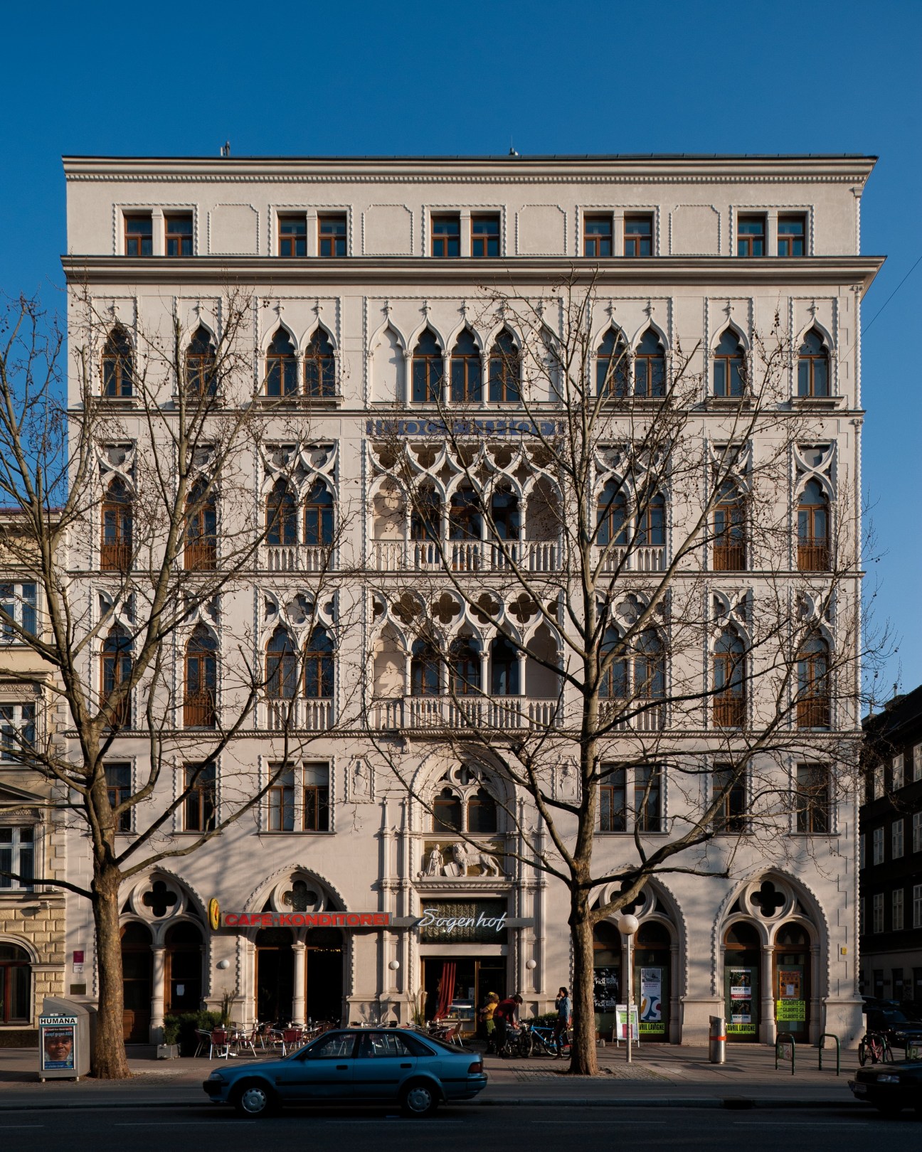 Ornate historic Gründerzeit building facade with decorative stonework and arched windows in Vienna's Leopoldstadt district.