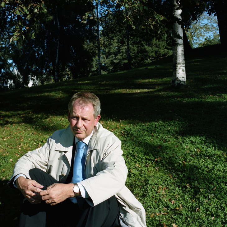 Anders Hulterstrom, Gothenburg's budget secretary, sits in a park wearing a light jacket and blue tie.
