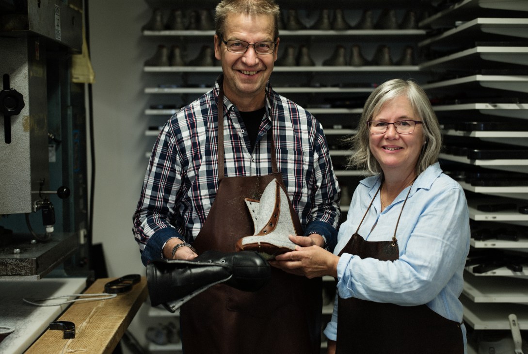 Bengt and Agneta Rådman hold a handmade leather boot in their Winter Life factory workshop.