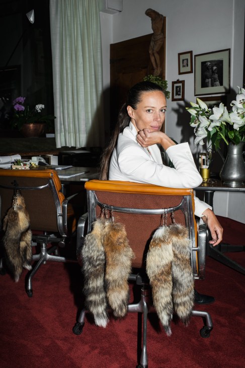 Cellina von Mannstein, manager of Forst brewery, sitting in an office chair wearing a white blazer.