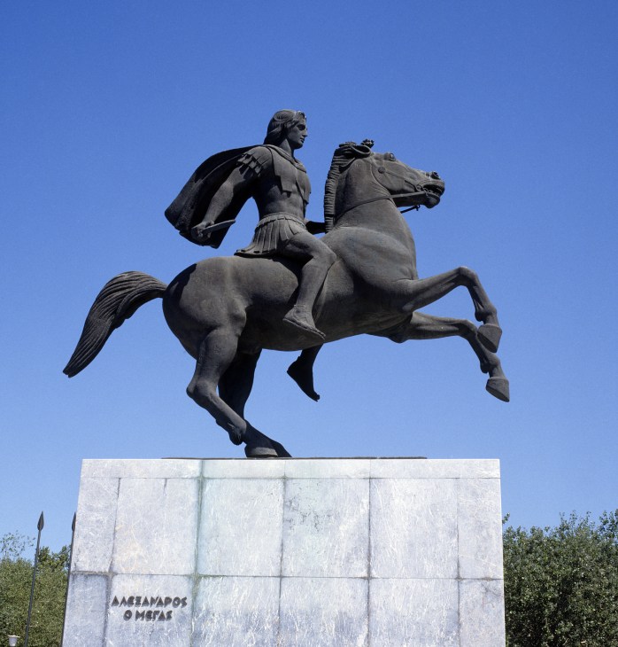 Equestrian statue of Alexander the Great on horseback against a clear blue sky in Thessaloniki.