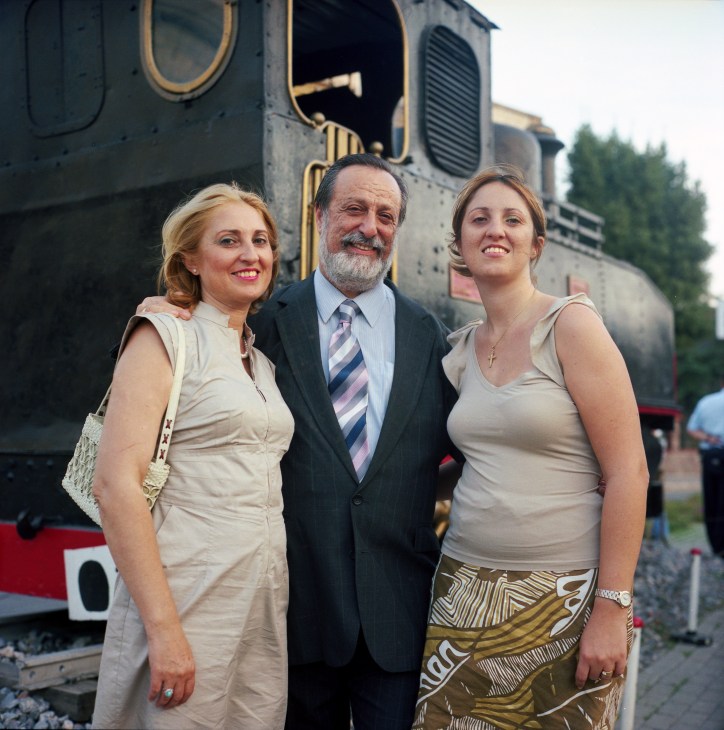 William, Amelia and Mary-Jane Buttigieg pose together in front of a vintage steam locomotive.